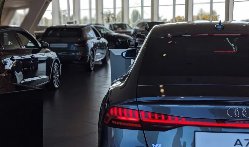 Modern car dealership showroom with vehicles on display